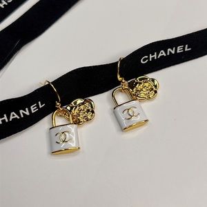 Chanel white lock and Camellia earrings